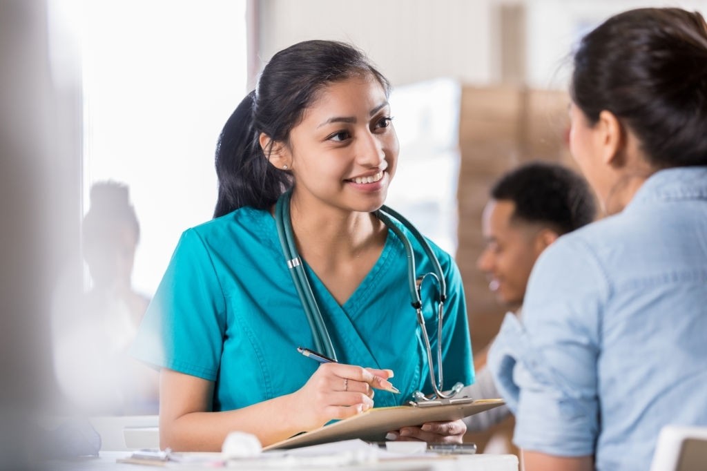 female doctor looking a patient